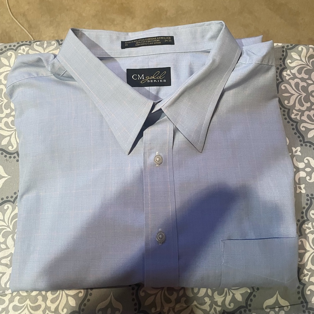 Beautiful ultra high quality dress shirt.  Blue with subtle pink stripes.